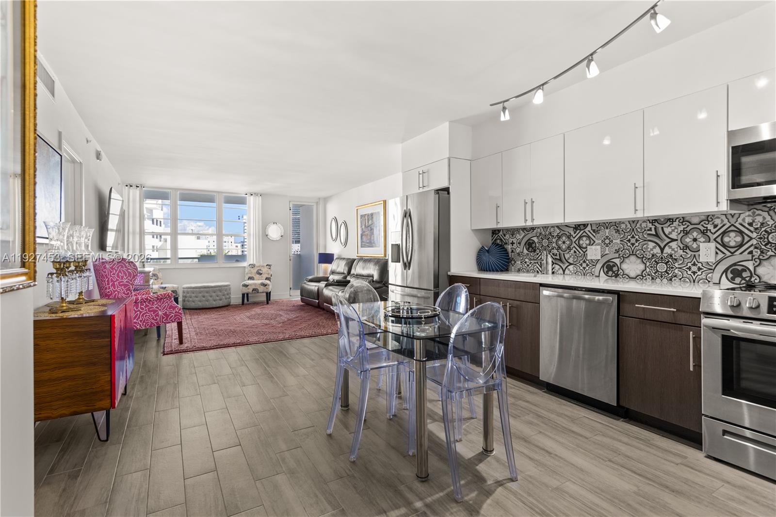 100 Lincoln Road, Unit 643 Miami Beach, FL 33139 - Photo 6 of 17 a view of a dining room with furniture and wooden floor
