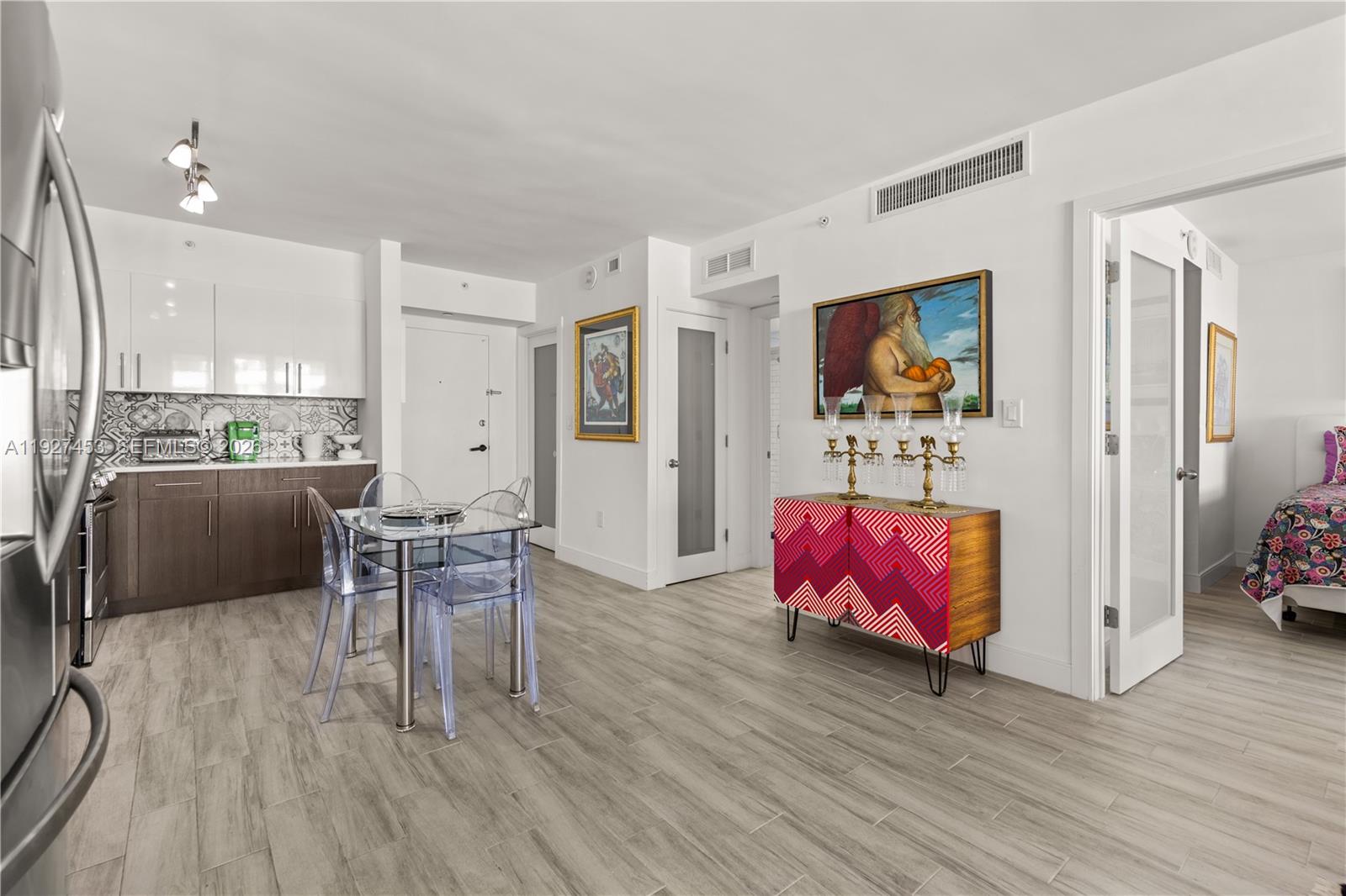 100 Lincoln Road, Unit 643 Miami Beach, FL 33139 - Photo 8 of 17 a living room with furniture and wooden floor