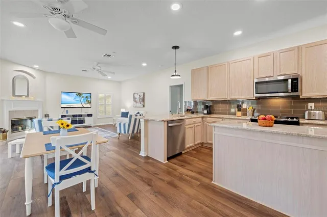 a kitchen with counter space cabinets and appliances