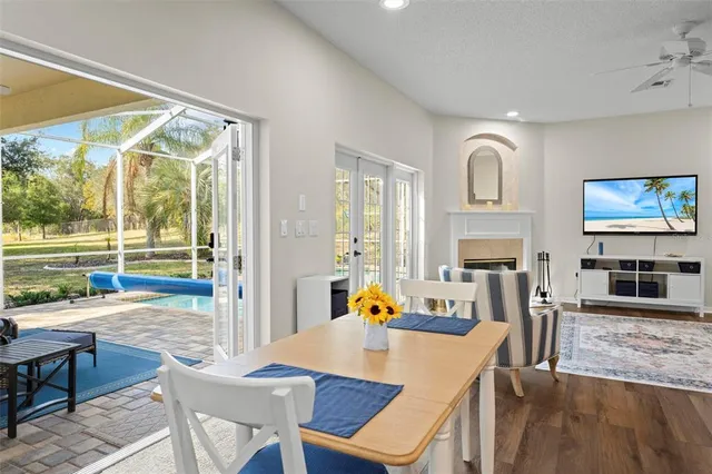 a view of a dining room with furniture window and wooden floor