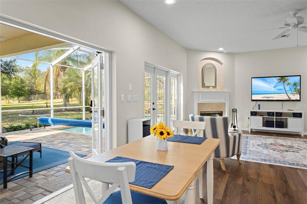 332 McIntosh Court Spring Hill, FL 34609 - Photo 18 of 54 a view of a dining room with furniture window and wooden floor