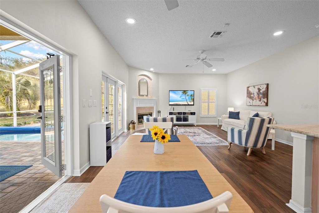 332 McIntosh Court Spring Hill, FL 34609 - Photo 19 of 54 a living room with furniture and a wooden floor