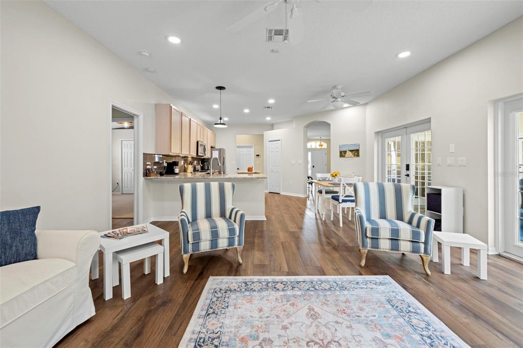 332 McIntosh Court Spring Hill, FL 34609 - Photo 25 of 54 a living room with furniture and a wooden floor
