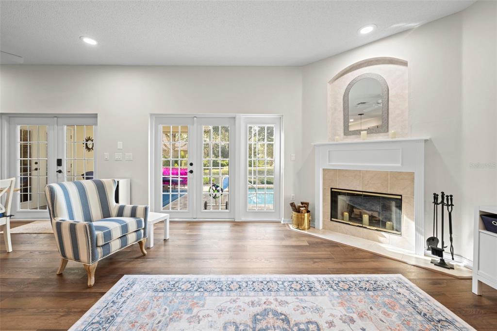 332 McIntosh Court Spring Hill, FL 34609 - Photo 28 of 54 a living room with furniture and a fireplace
