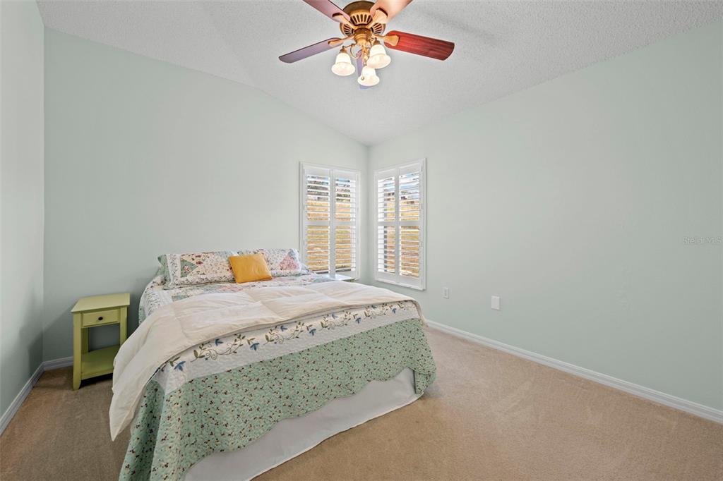 332 McIntosh Court Spring Hill, FL 34609 - Photo 40 of 54 a bedroom with a bed and window