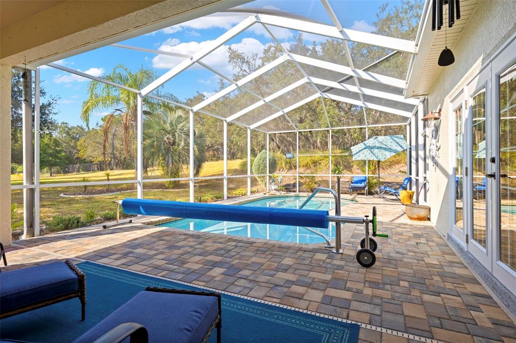 332 McIntosh Court Spring Hill, FL 34609 - Photo 51 of 54 a view of a swimming pool with a lounge chairs