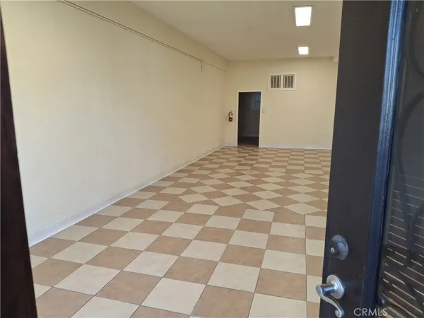 a view of a livingroom with a black and white checkered floor