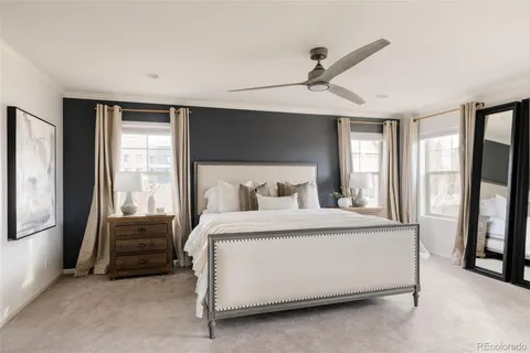 a bed sitting in a room next to a window