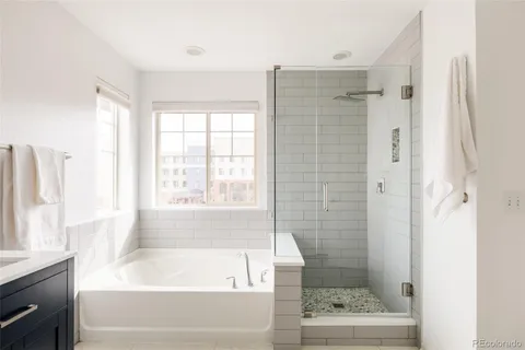 a bathroom with a bathtub and a shower
