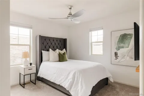 a bedroom with a large bed and a window