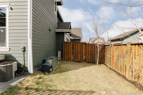 a view of a backyard with furniture and a garage