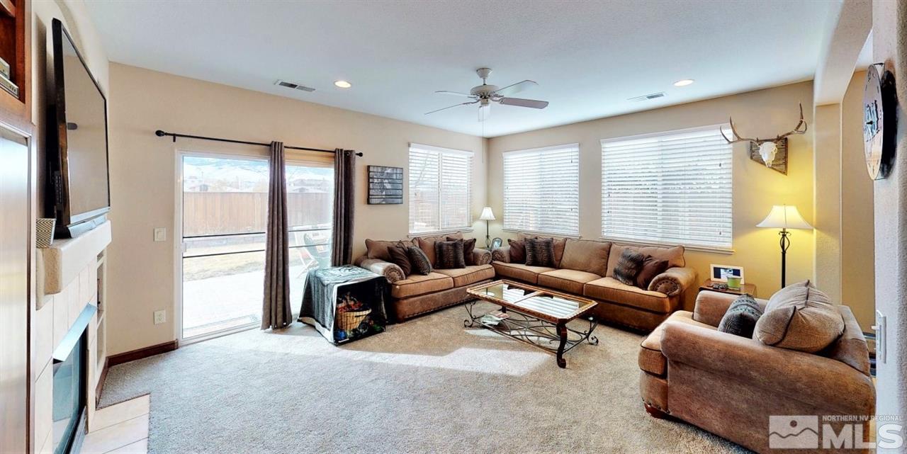 10615 Arbor Way Reno, NV 89521 - Photo 11 of 23 a living room with furniture and a flat screen tv