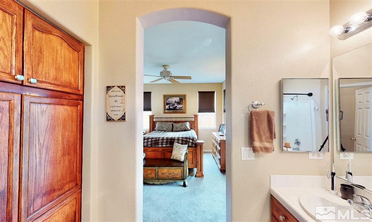10615 Arbor Way Reno, NV 89521 - Photo 16 of 23 a bathroom with a sink and a mirror