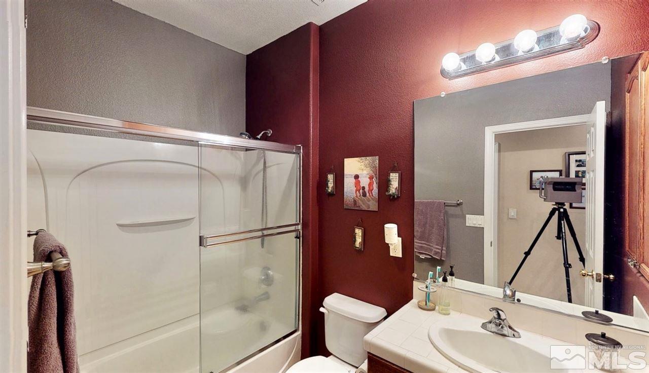 10615 Arbor Way Reno, NV 89521 - Photo 20 of 23 a bathroom with a sink and a mirror