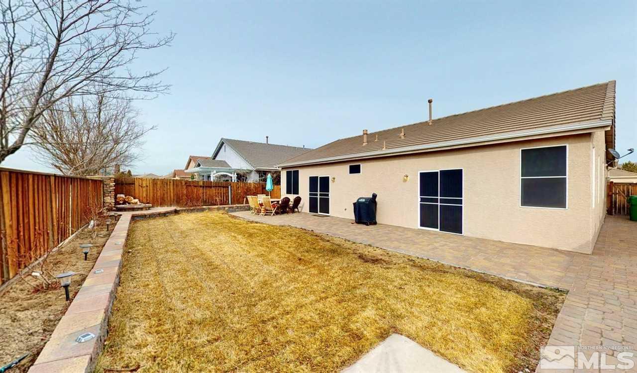 10615 Arbor Way Reno, NV 89521 - Photo 22 of 23 a swimming pool with yard and wooden fence