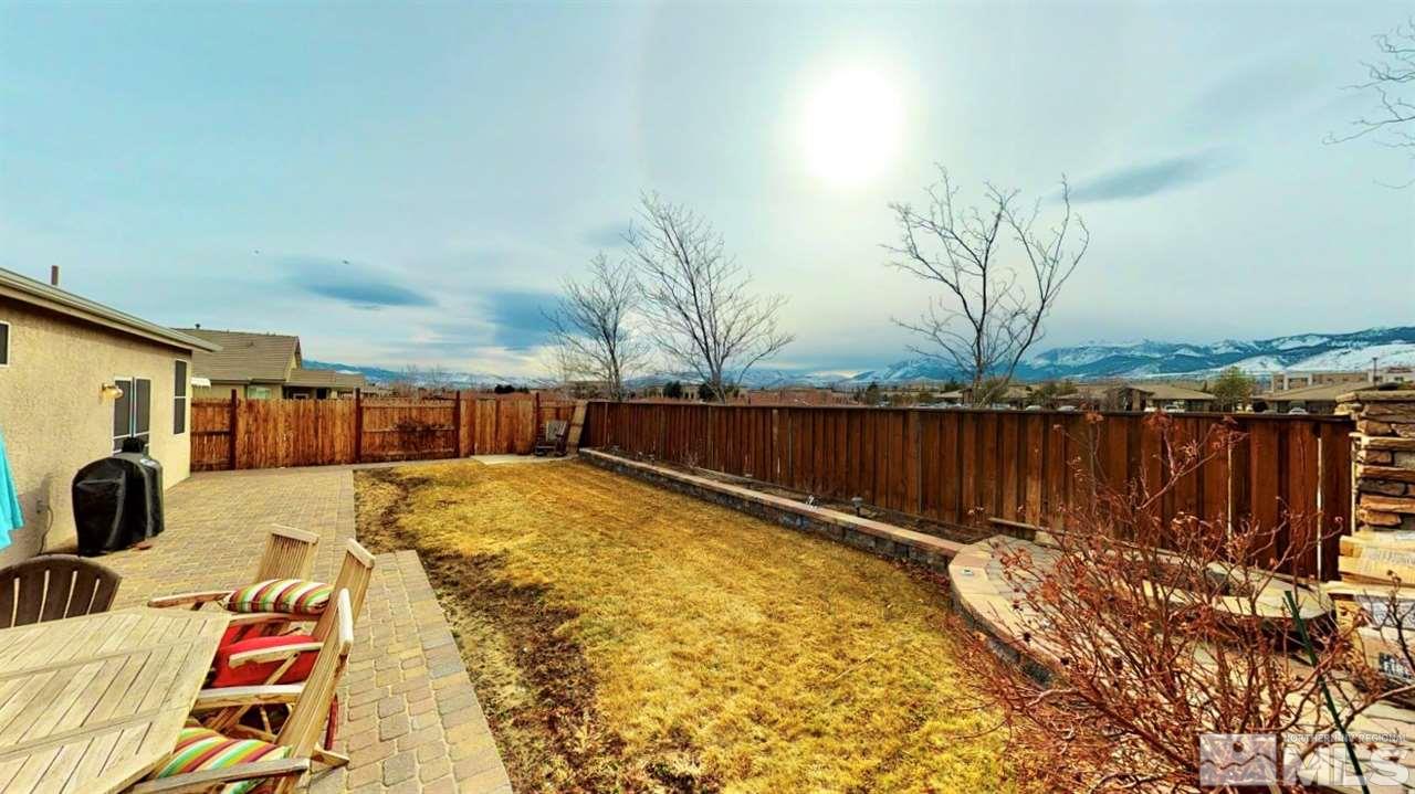 10615 Arbor Way Reno, NV 89521 - Photo 23 of 23 a view of swimming pool with table and chairs a barbeque
