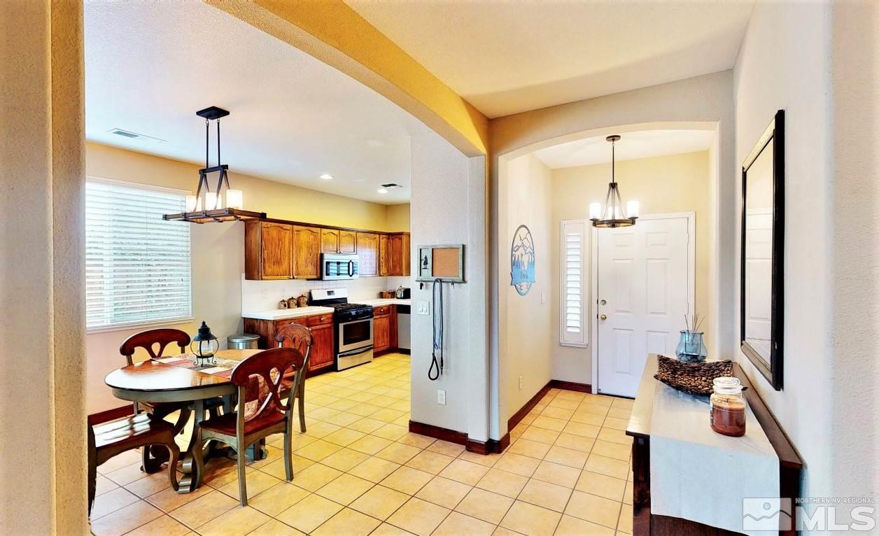 10615 Arbor Way Reno, NV 89521 - Photo 3 of 23 a view of kitchen with dining table and chairs
