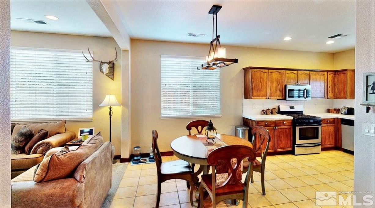 10615 Arbor Way Reno, NV 89521 - Photo 5 of 23 a view of a dining room with furniture