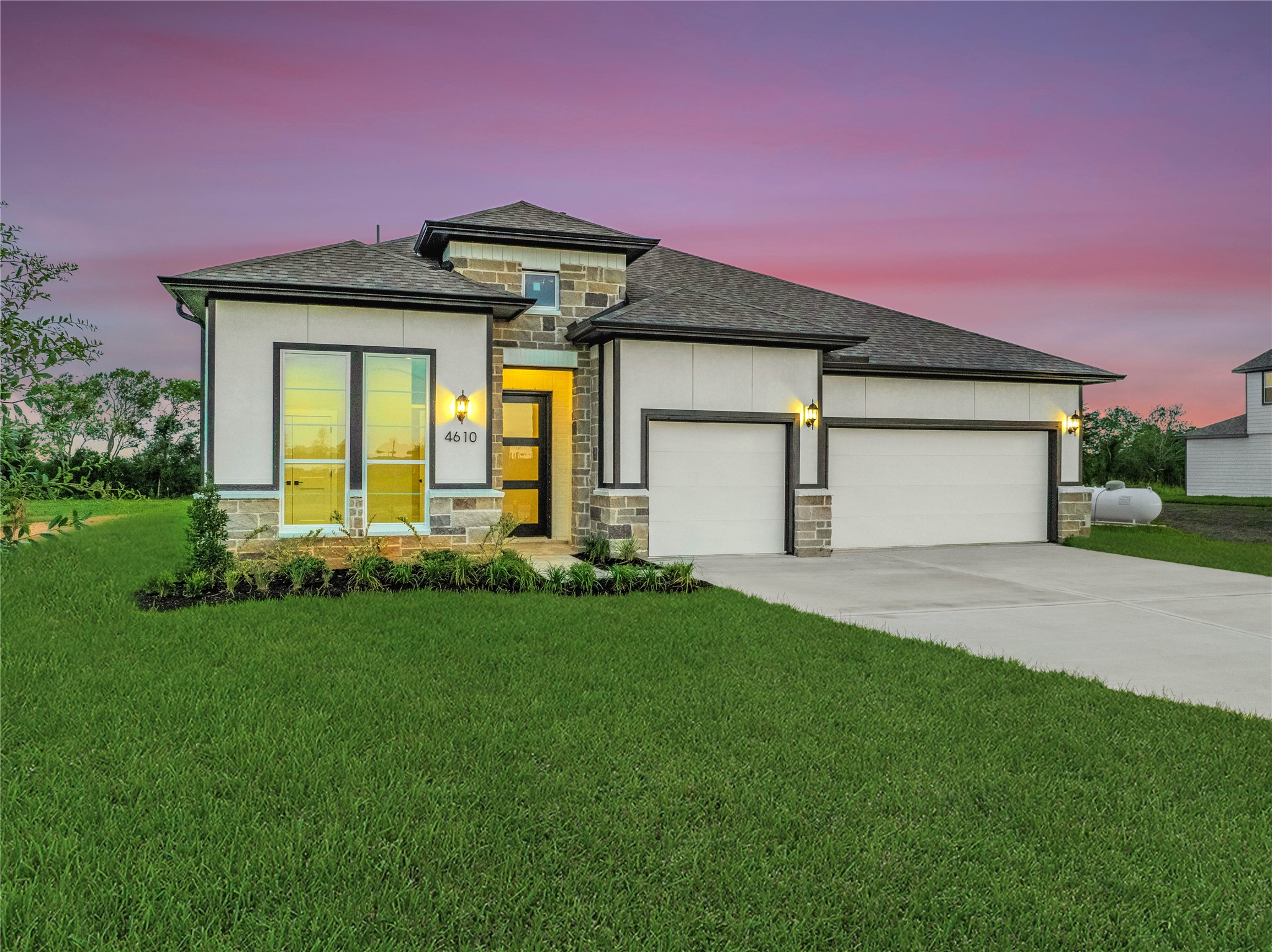 4610 Magnolia Bend Drive Rosharon, TX 77583 - Photo 2 of 48 a front view of a house with a yard and garage