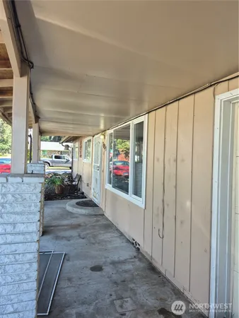 a view of an entryway with flower plants