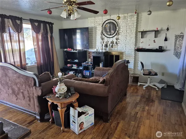 a living room with furniture and a fireplace