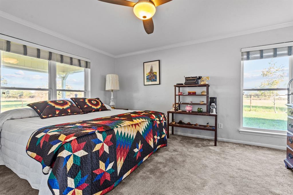 905 Ballew Springs Road Weatherford, TX 76088 - Photo 22 of 40 a bedroom with a bed and window