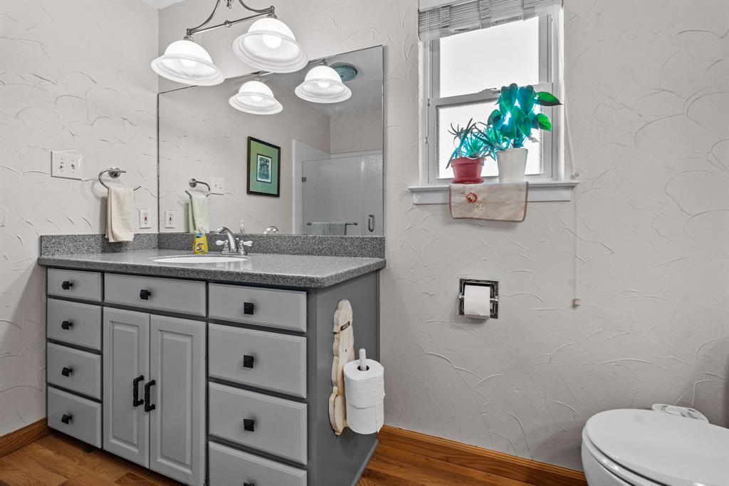 905 Ballew Springs Road Weatherford, TX 76088 - Photo 23 of 40 a bathroom with a sink vanity and a mirror