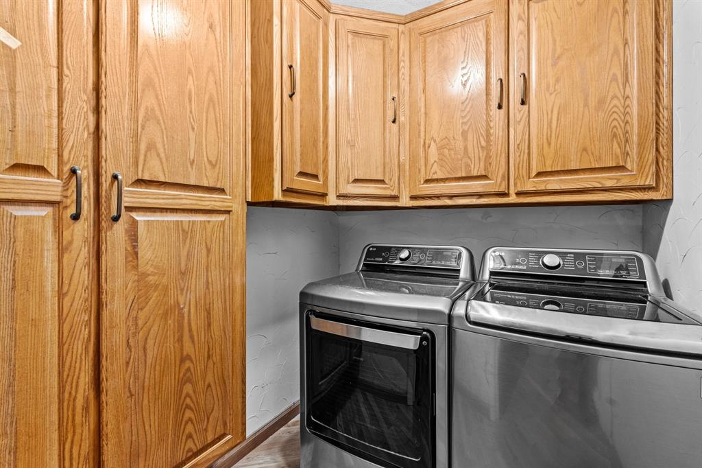 905 Ballew Springs Road Weatherford, TX 76088 - Photo 26 of 40 a kitchen with a stove top oven and cabinets