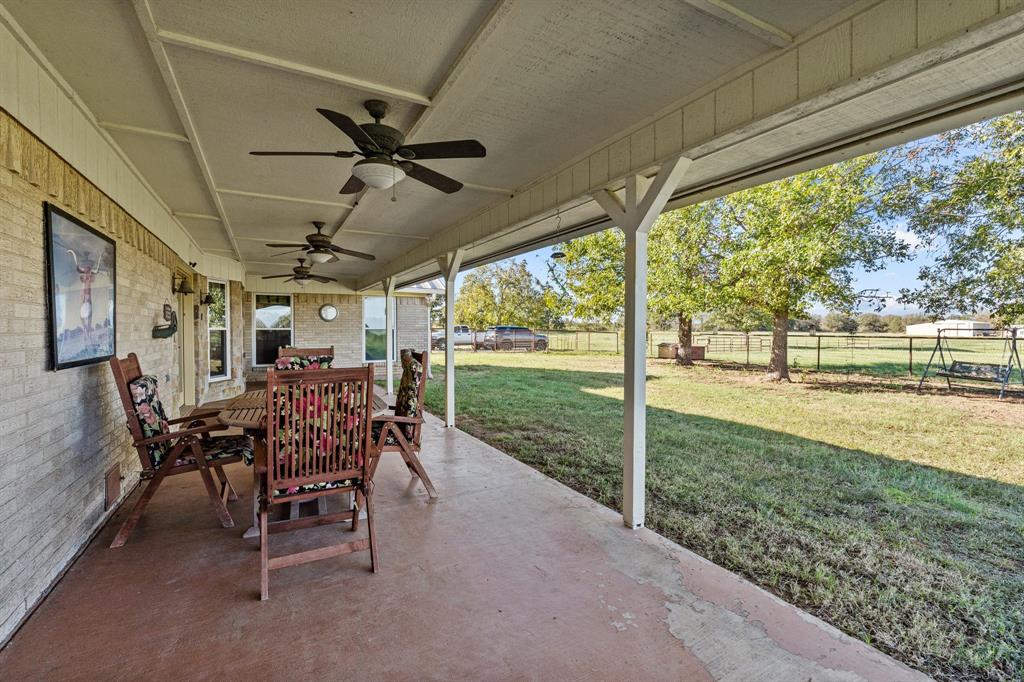 905 Ballew Springs Road Weatherford, TX 76088 - Photo 28 of 40 a view of a porch with chairs and backyard
