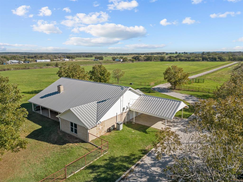 905 Ballew Springs Road Weatherford, TX 76088 - Photo 5 of 40 an aerial view of a house with a garden space and ocean view