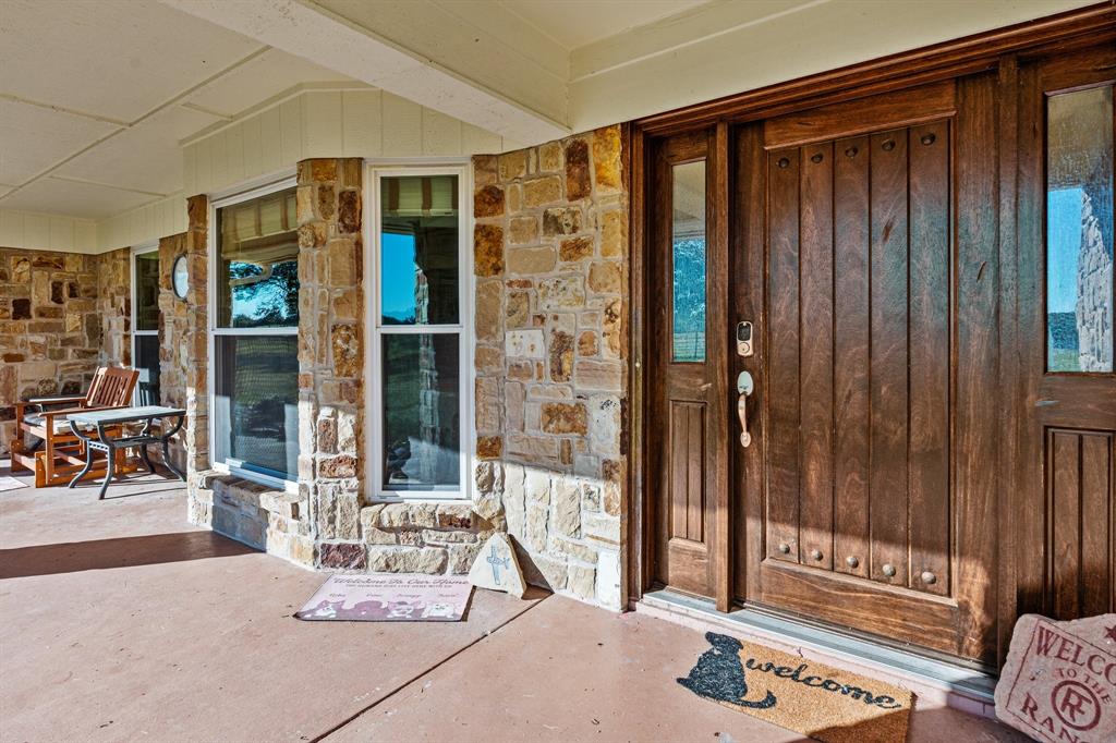 905 Ballew Springs Road Weatherford, TX 76088 - Photo 10 of 40 a living room with a large window and couch