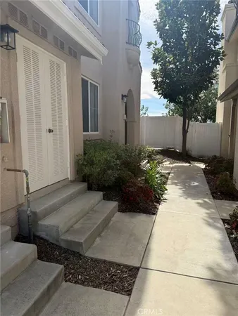 a view of a backyard of the house