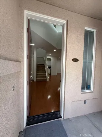 an empty room with closet and a ceiling fan