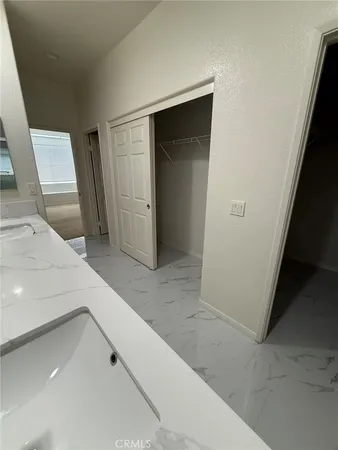 a bathroom with a glass door shower