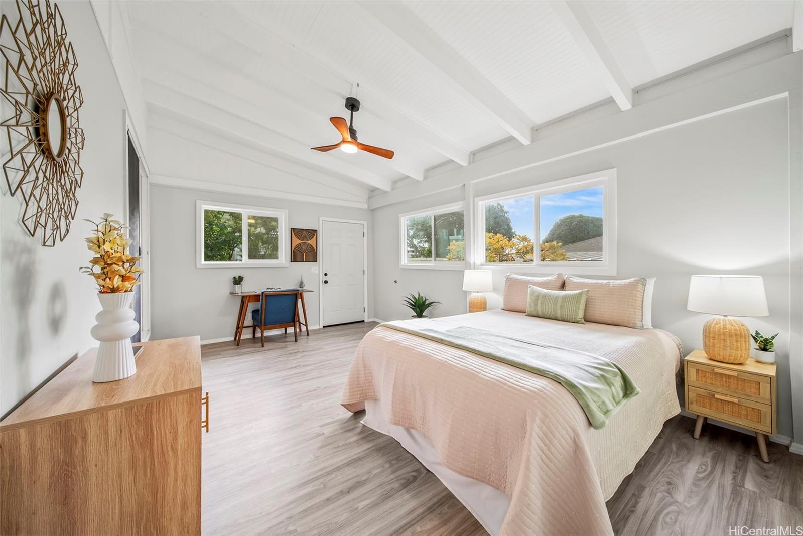 809 Hao Street Honolulu, HI 96821 - Photo 18 of 25 a spacious bedroom with a bed a couch and a window
