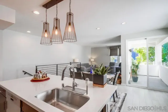 a living room with furniture a flat screen tv and a floor to ceiling window