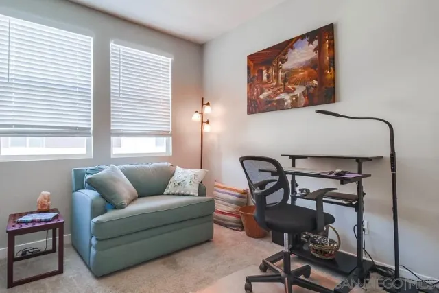 a bedroom with furniture and a window