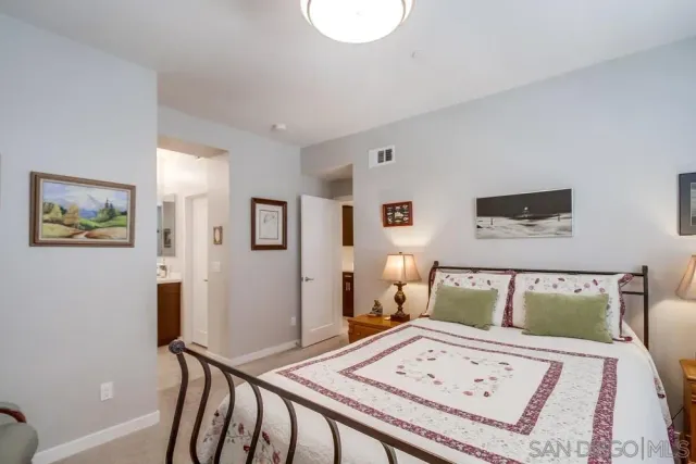 a bed room with a bed and a dresser