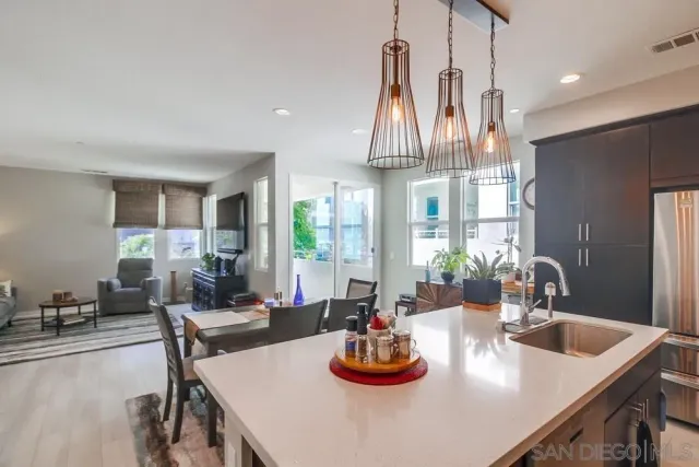 a kitchen with a sink and refrigerator