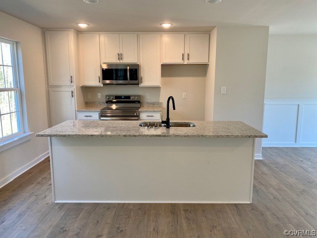 2 Brook Boulevard Quinton, VA 23141 - Photo 5 of 16 a kitchen with kitchen island granite countertop a stove top oven a sink and a granite counter top