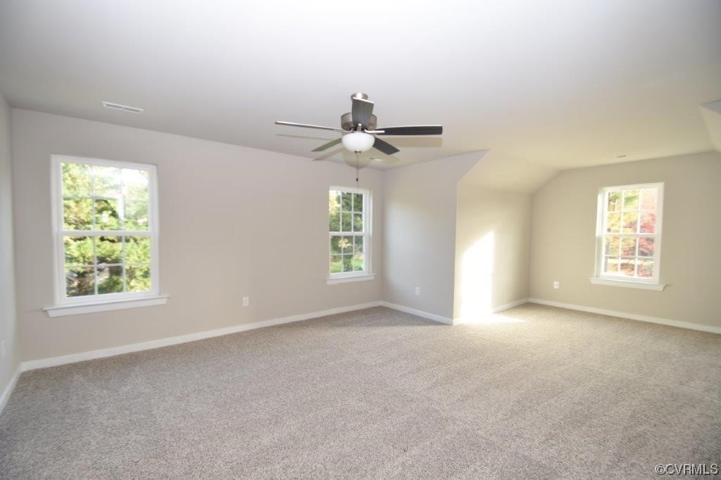 2 Brook Boulevard Quinton, VA 23141 - Photo 9 of 16 an empty room with windows and chandelier fan