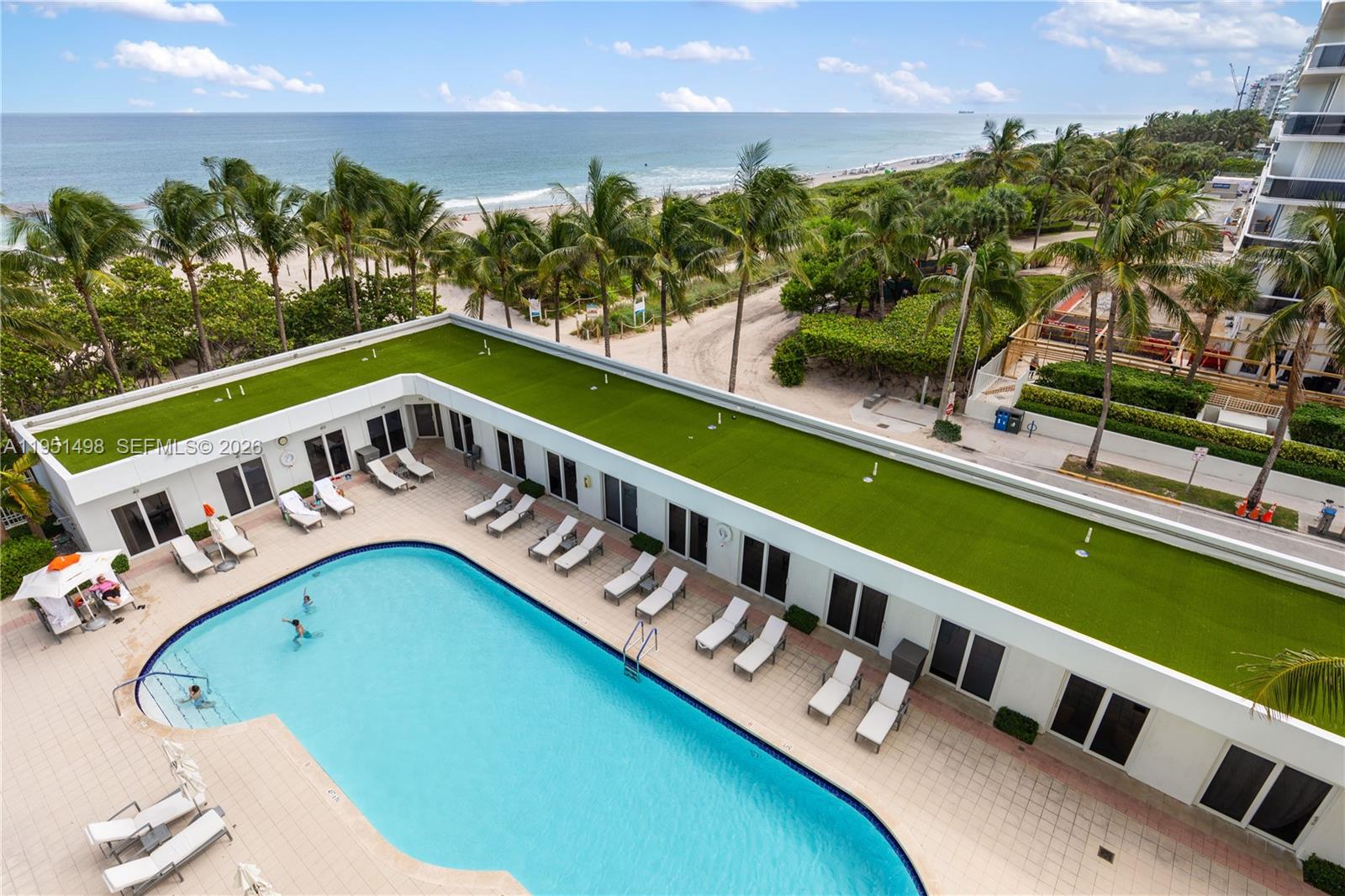 9601 Collins Avenue, Unit 507 Bal Harbour, FL 33154 - Photo 38 of 40 a view of swimming pool with outdoor space and seating area