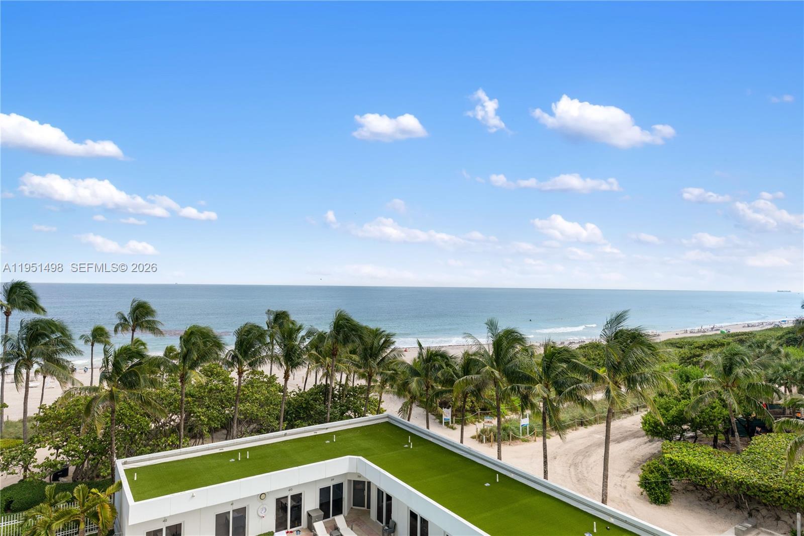 9601 Collins Avenue, Unit 507 Bal Harbour, FL 33154 - Photo 39 of 40 a view of a swimming pool with an outdoor seating