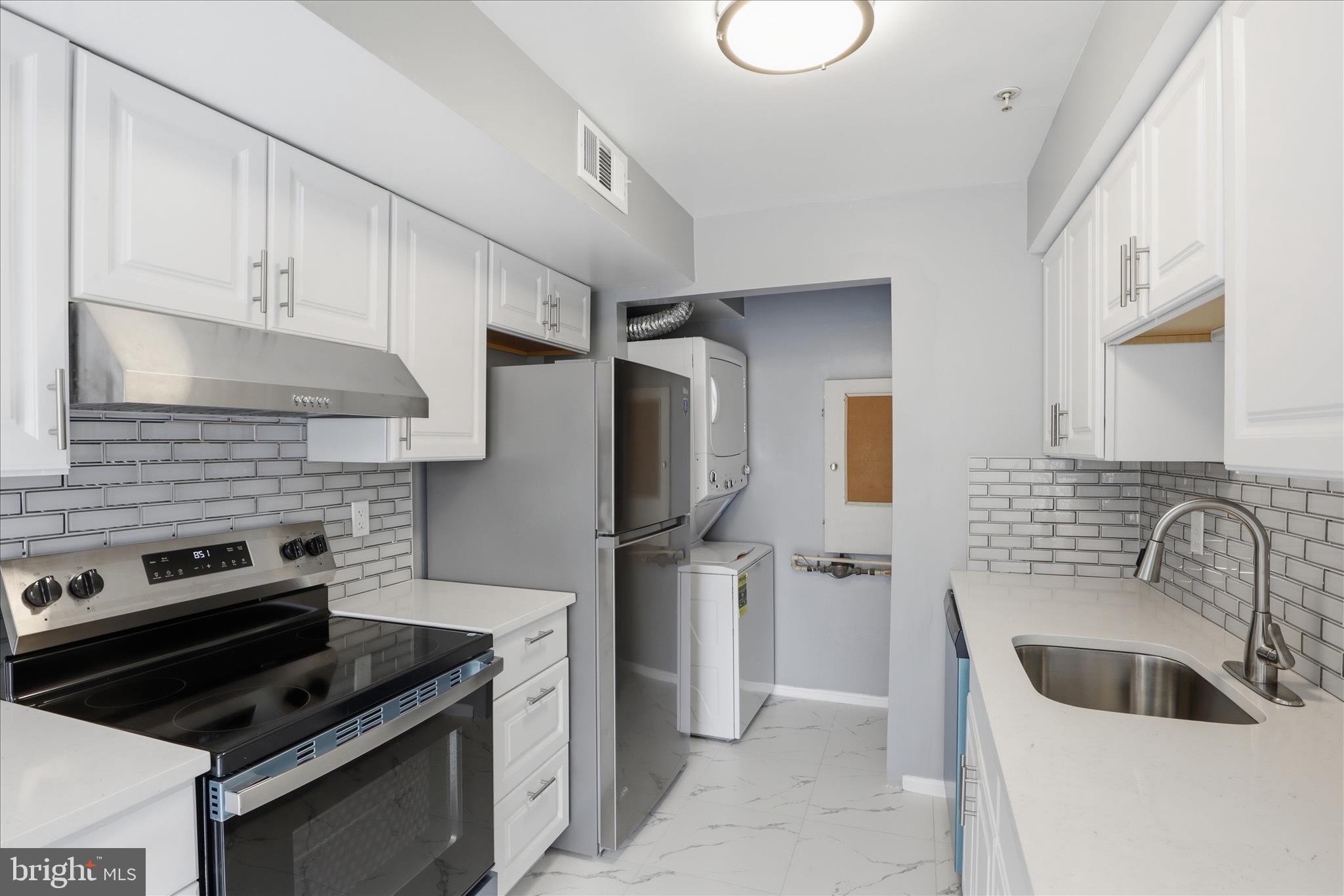 14913 Cleese Court, Unit C Silver Spring, MD 20906 - Photo 15 of 35 a kitchen with a sink cabinets and stainless steel appliances