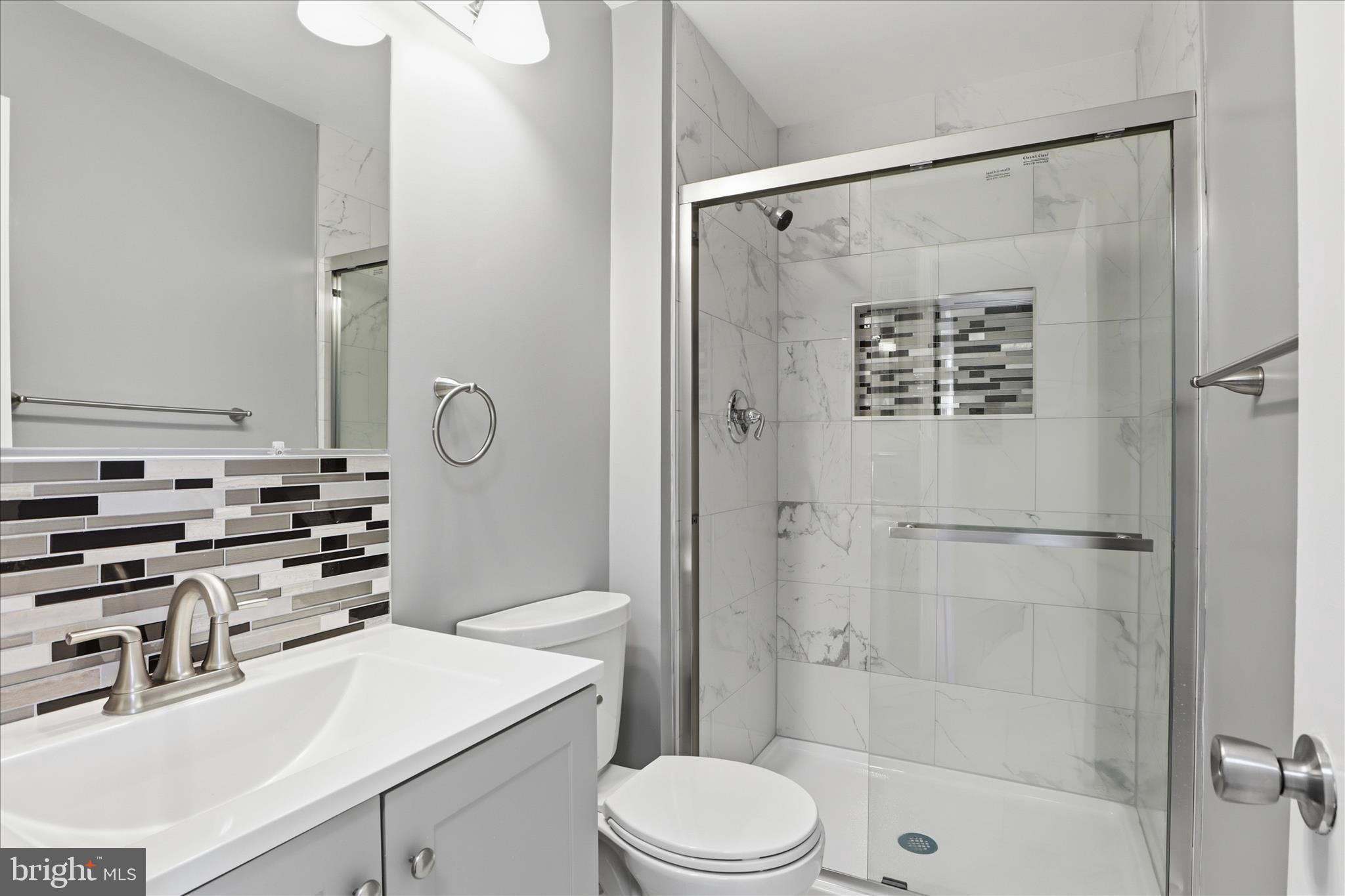 14913 Cleese Court, Unit C Silver Spring, MD 20906 - Photo 24 of 35 a bathroom with a sink a toilet and shower