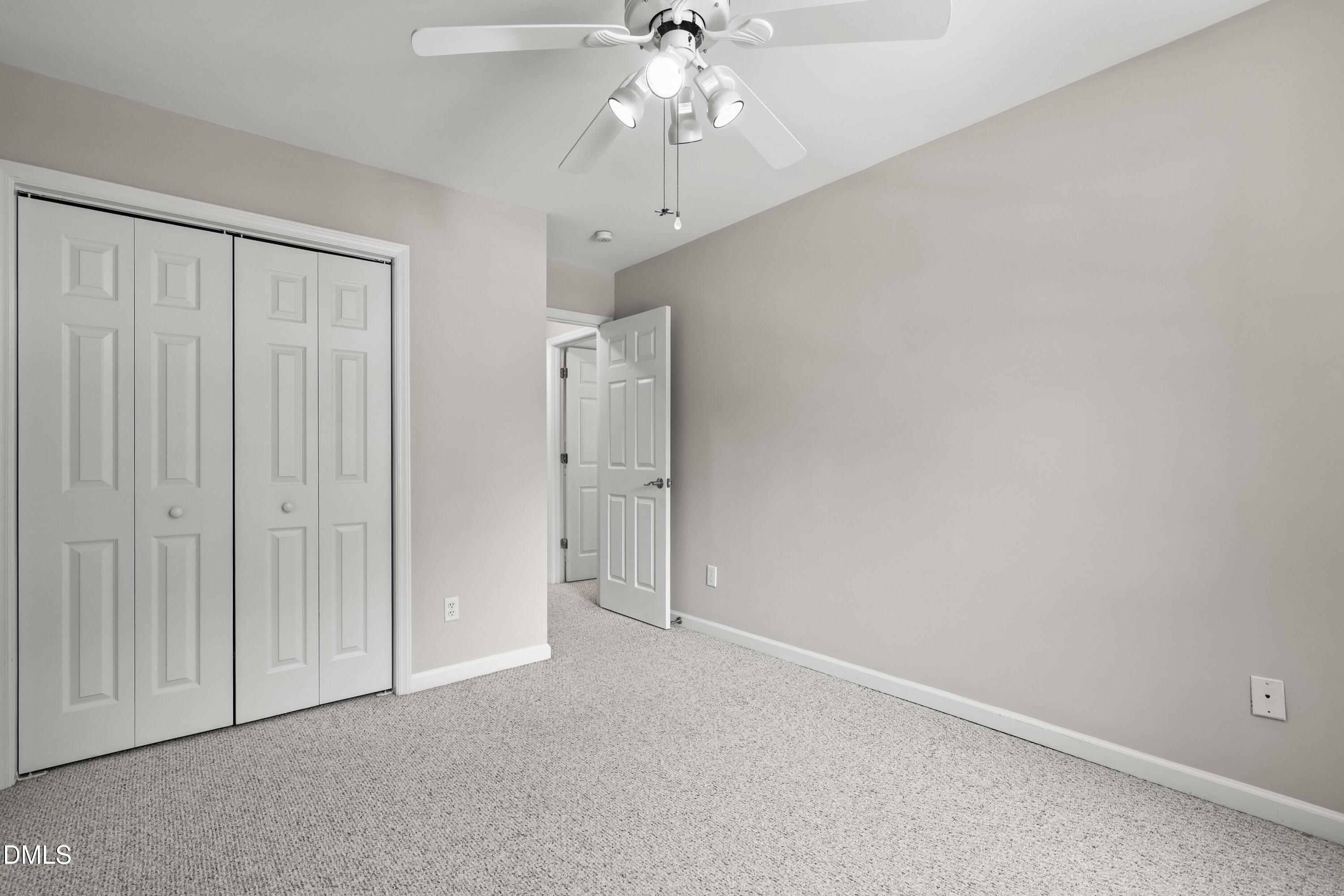 3015 Rennit Court Raleigh, NC 27603 - Photo 28 of 40 an empty room with chandelier fan and closet area
