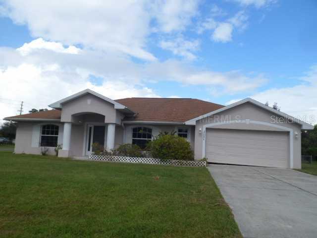25026 Palisade Road Punta Gorda, FL 33983 - Photo 1 of 1 a front view of house with yard and green space