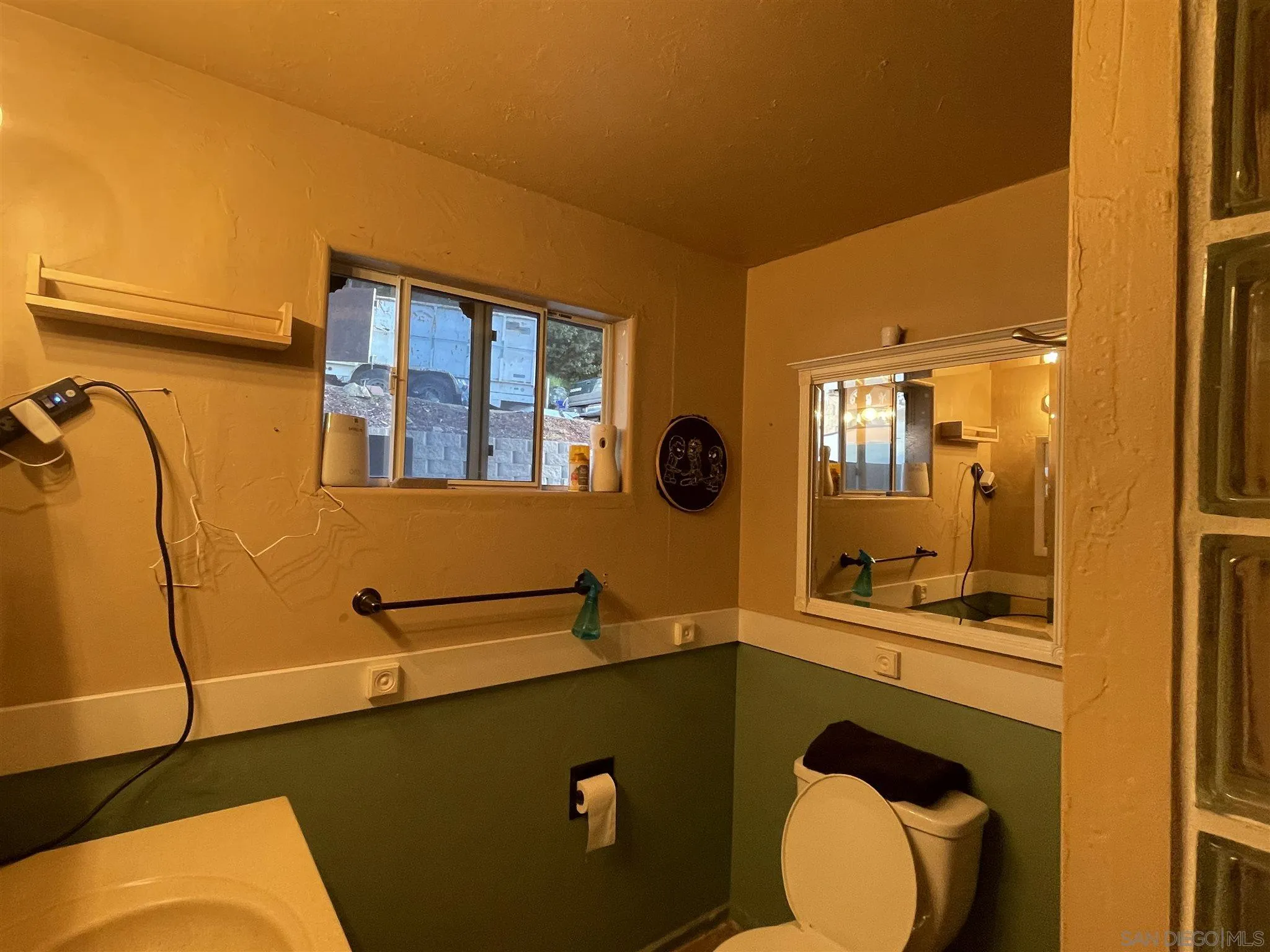 8223 Highway 79 Guatay, CA 91931 - Photo 18 of 26 a bathroom with a sink mirror vanity and toilet