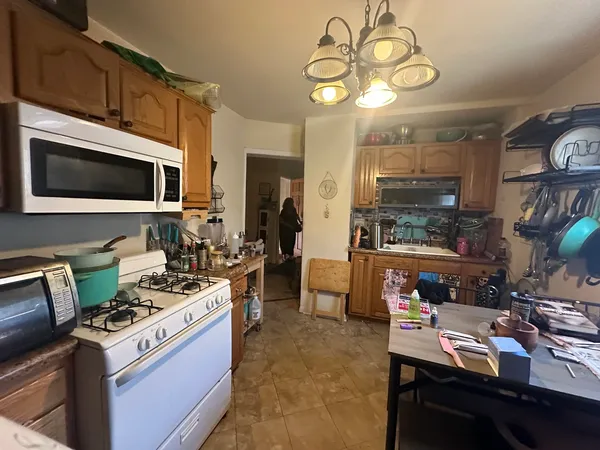 a kitchen with a stove and a microwave