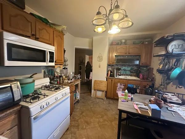 a kitchen with a stove and a microwave